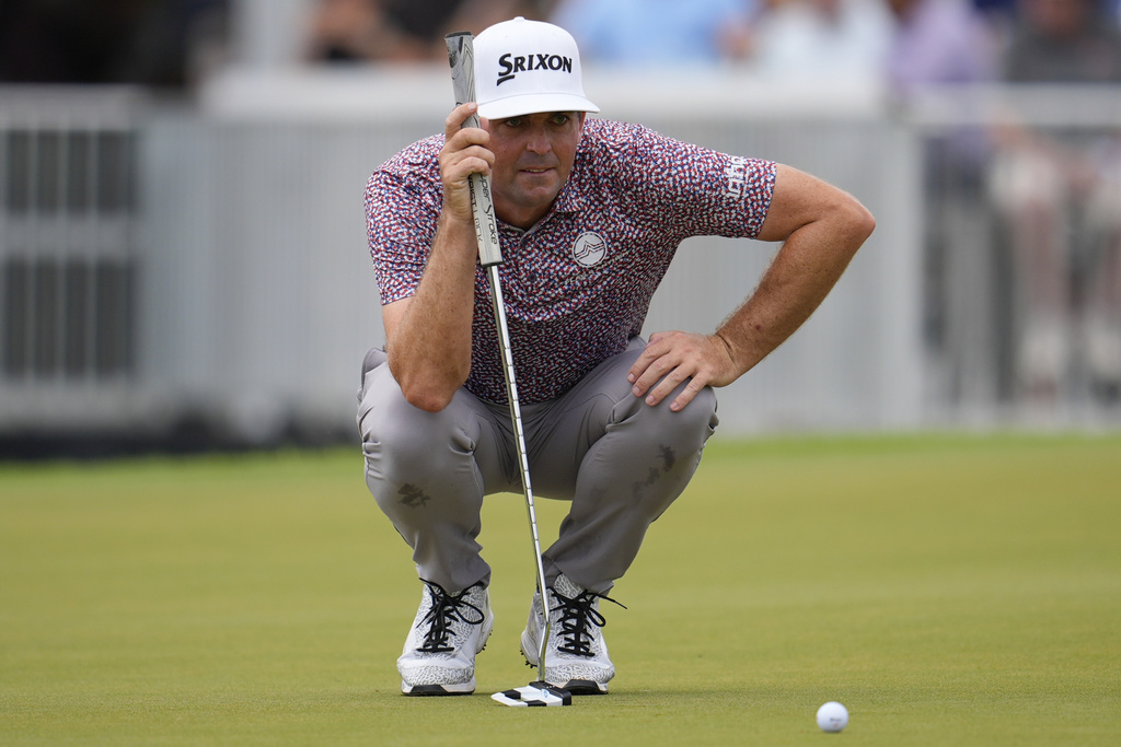 Keegan Bradley lines up a putt on the third green during the final round of the Tour Championship golf tournament, Sunday, Aug. 24, 2025, in Atlanta. (AP Photo/Mike Stewart)