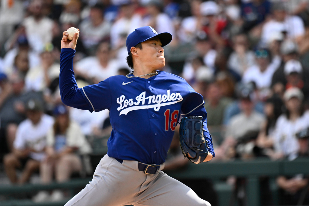 Los Angeles Dodgers pitcher Yoshinobu Yamamoto (18) delivers during the fifth inning of a baseball game against the Chicago White Sox, Saturday, June 13, 2026, in Chicago. (AP Photo/Matt Marton)