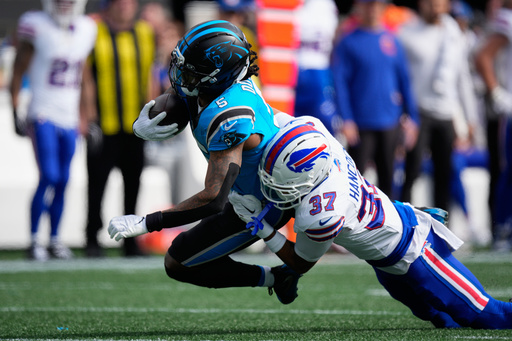 Buffalo Bills cornerback Jordan Hancock (37) tackles Carolina Panthers running back Rico Dowdle (5) during the first half an NFL football game, Sunday, Oct. 26, 2025, in Charlotte, N.C. (AP Photo/Jacob Kupferman) Buffalo Bills cornerback Jordan Hancock (37) tackles Carolina Panthers running back Rico Dowdle (5) during the first half an NFL football game, Sunday, Oct. 26, 2025, in Charlotte, N.C. (AP Photo/Jacob Kupferman)