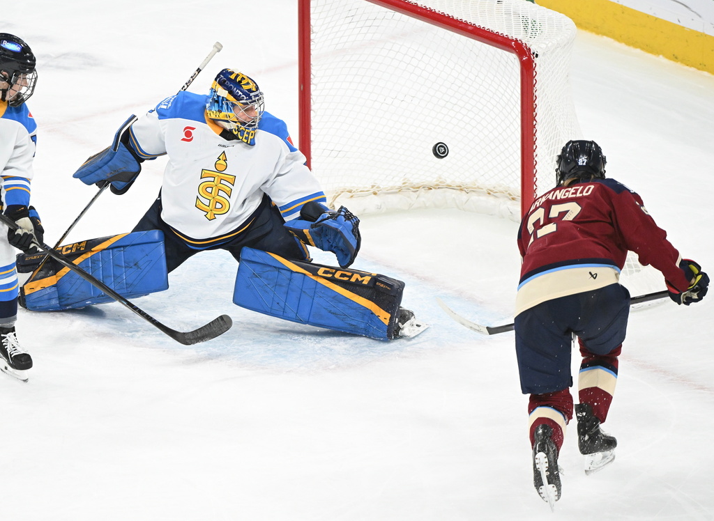 Montreal Victoire's Shiann Darkangelo (27) scores against Toronto Sceptres' goaltender Raygan Kirk during the second period of an PWHL hockey game in Laval, Quebec, Wednesday, Jan. 28, 2026. (Graham Hughes/The Canadian Press via AP)