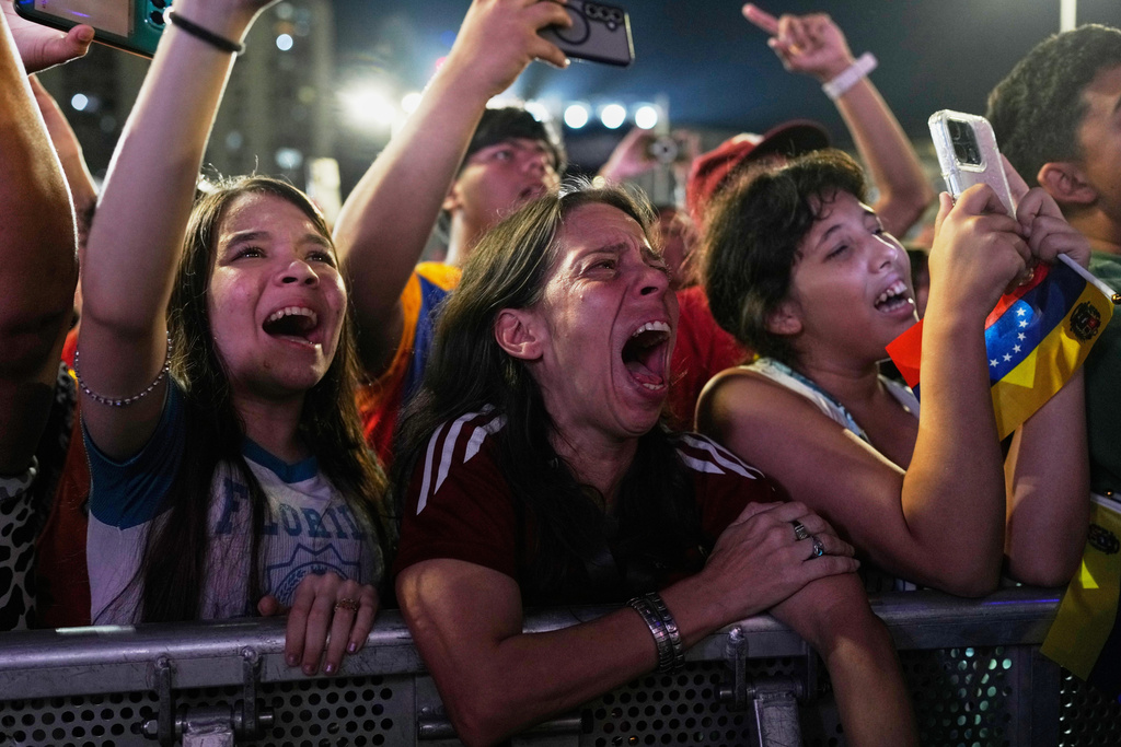 Venezuela fans celebrate their country's win against the United States in the championship match of the World Baseball Classic a day prior, in Caracas, Venezuela, Wednesday, March 18, 2026. (AP Photo/Ariana Cubillos)