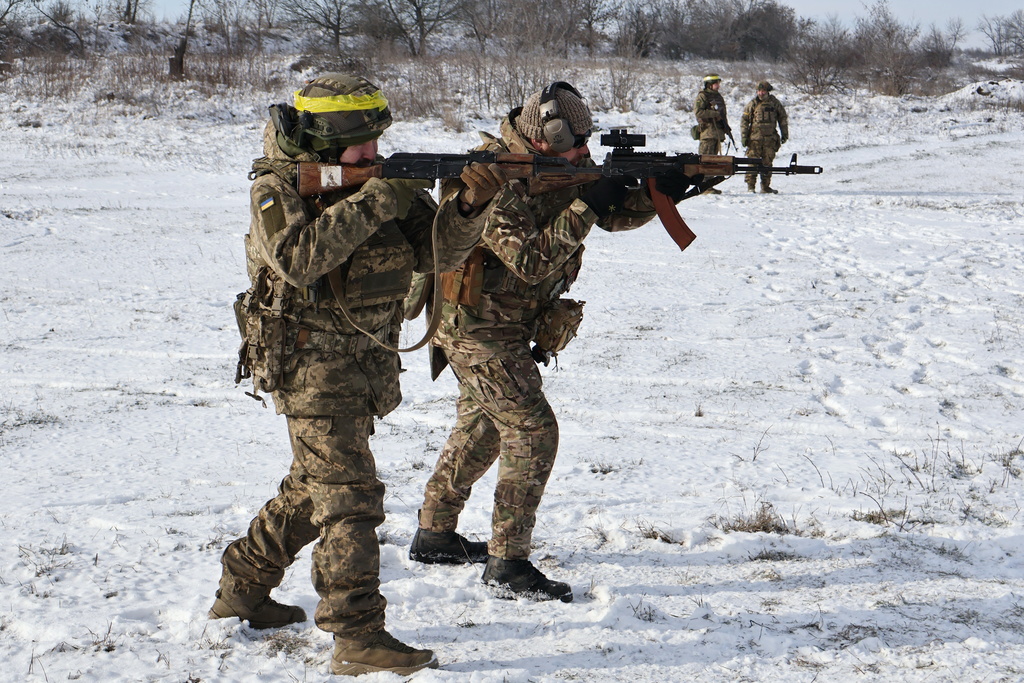 CORRECTS DATE In this photo provided by Ukraine's 65th Mechanized Brigade press service, recruits perform drills at a training ground in the Zaporizhzhia region, Ukraine, Tuesday, Jan. 20, 2026. (Andriy Andriyenko/Ukraine's 65th Mechanized Brigade via AP)