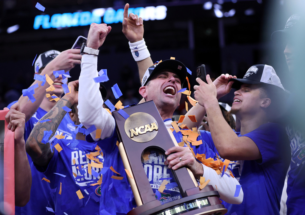 FILE - Florida head coach Todd Golden celebrates following his team's win over Texas Tech in the Elite Eight of the NCAA college basketball tournament, Saturday, March 29, 2025, in San Francisco. (Scott Strazzante/San Francisco Chronicle via AP, file)