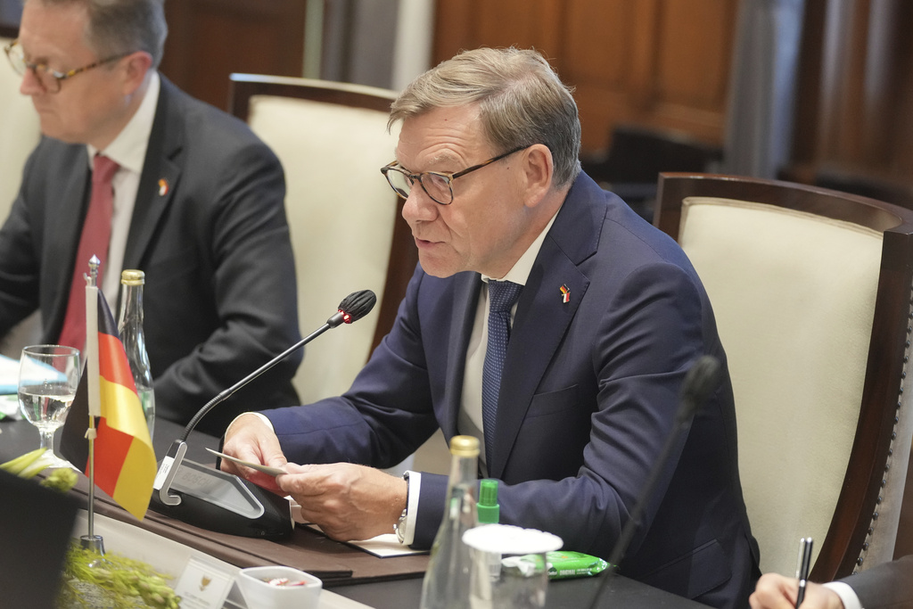 German Foreign Minister Johann Wadephul, right, speaks to his Indonesian counterpart Sugiono, unseen, during their bilateral meeting in Jakarta, Indonesia, Wednesday, Aug. 20, 2025. (AP Photo/Dita Alangkara)