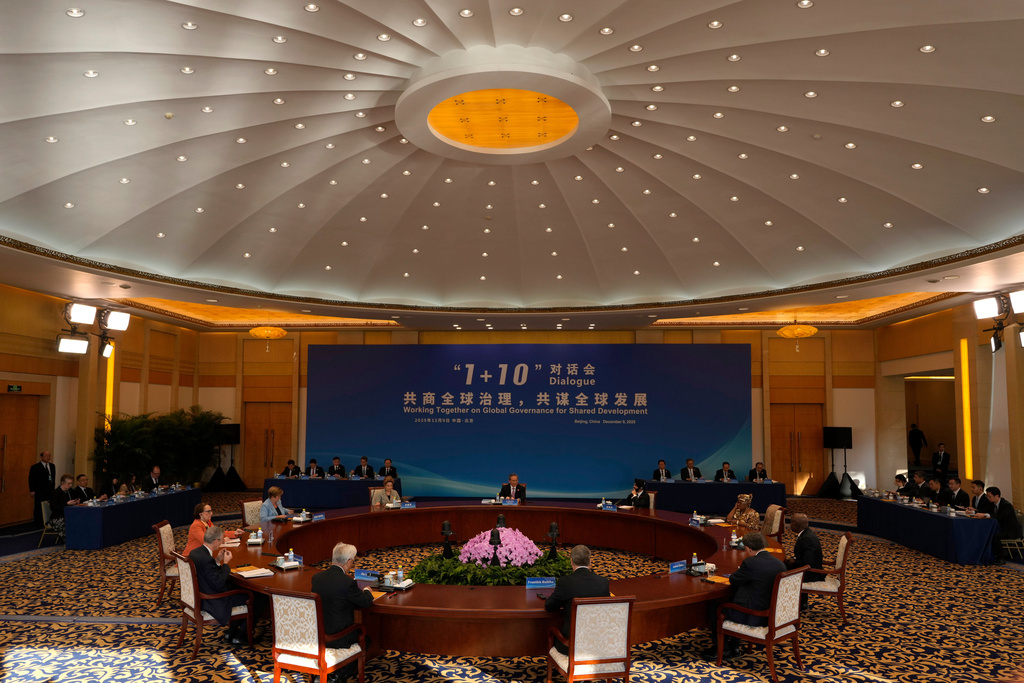Chinese Premier Li Qiang, center, hosts the 1+10 Dialogue with heads of major international economic organizations in Beijing, China, Tuesday, Dec. 9, 2025. (AP Photo/Ng Han Guan)