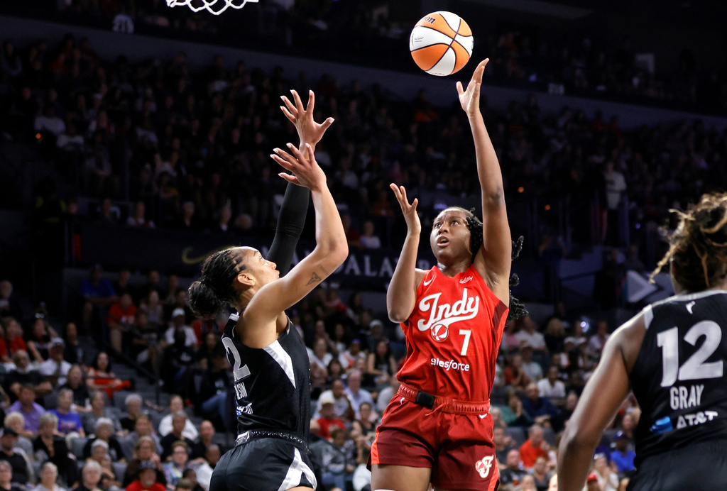Indiana Fever center-forward Aliyah Boston (7) shoots against Las Vegas Aces center A'ja Wilson (22) during the first half of an WNBA basketball game Sunday, July 12, 2026, in Las Vegas. (Steve Marcus/Las Vegas Sun via AP)