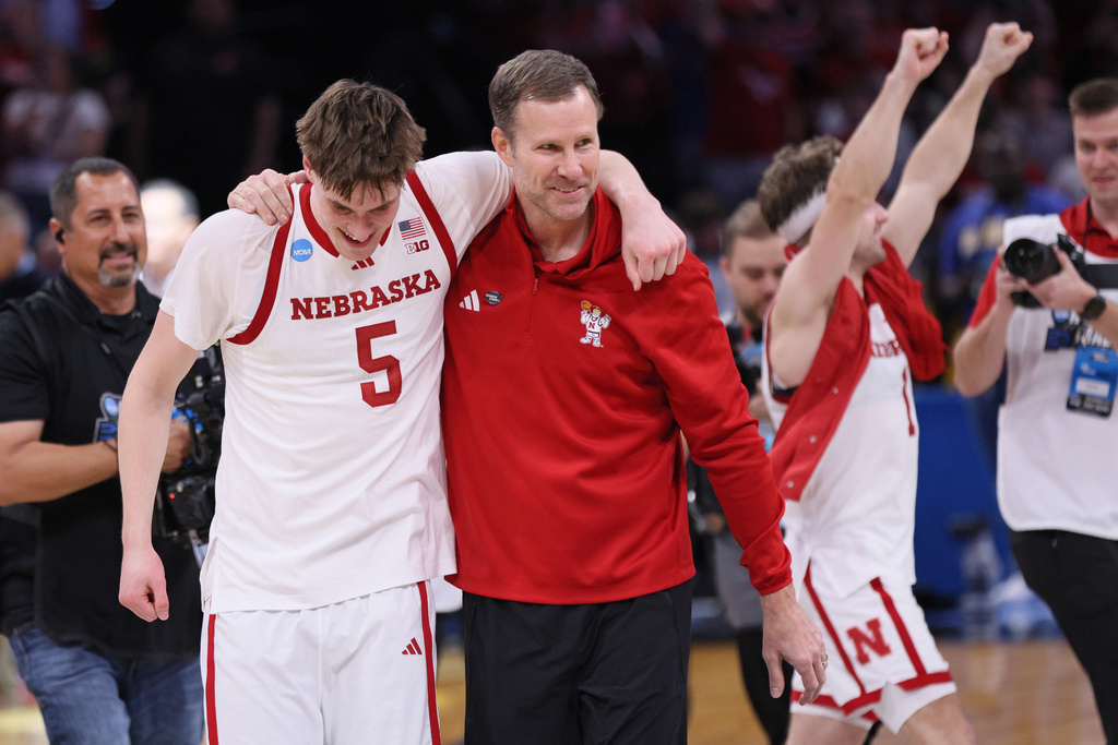 Nebraska forward Braden Frager (5) and head coach Fred Hoiberg walk off the court after a game against Troy in the first round of the NCAA college basketball tournament, Thursday, March 19, 2026, in Oklahoma City. (AP Photo/Nate Billings)