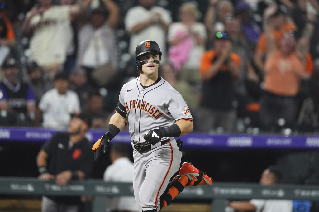 San Francisco Giants' Drew Gilbert circles the bases after hitting a solo home urn off Colorado Rockies relief pitcher Juan Mejia in the seventh inning of a baseball game Wednesday, Sept. 3, 2025, in Denver. (AP Photo/David Zalubowski)