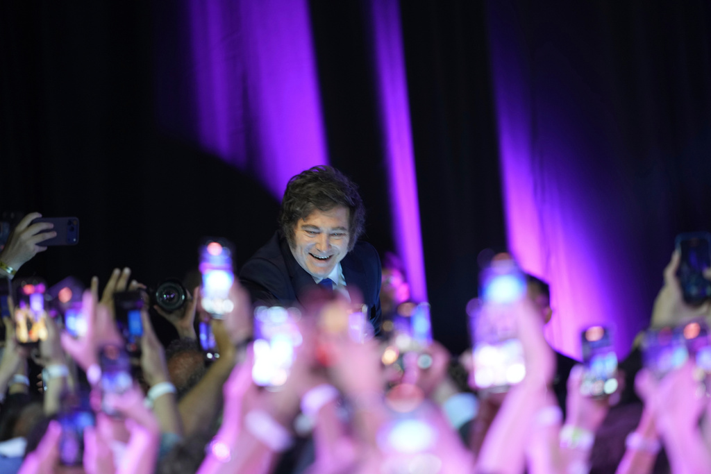 Argentina's President Javier Milei smiles to supporters after winning in legislative midterm elections in Buenos Aires, Argentina, Sunday, Oct. 26, 2025. (AP Photo/Rodrigo Abd)