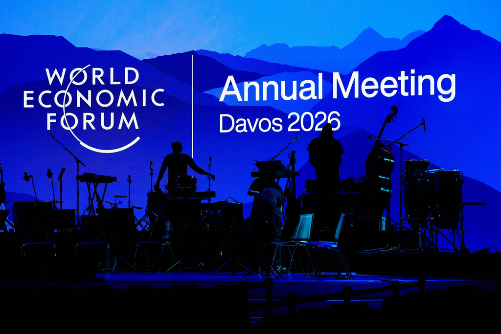 People set up the instruments for the opening concert of the Annnual Meeting of the World Economy Forum at the Congress Center in Davos, Switzerland, Sunday, Jan. 18, 2026. (AP Photo/Markus Schreiber)