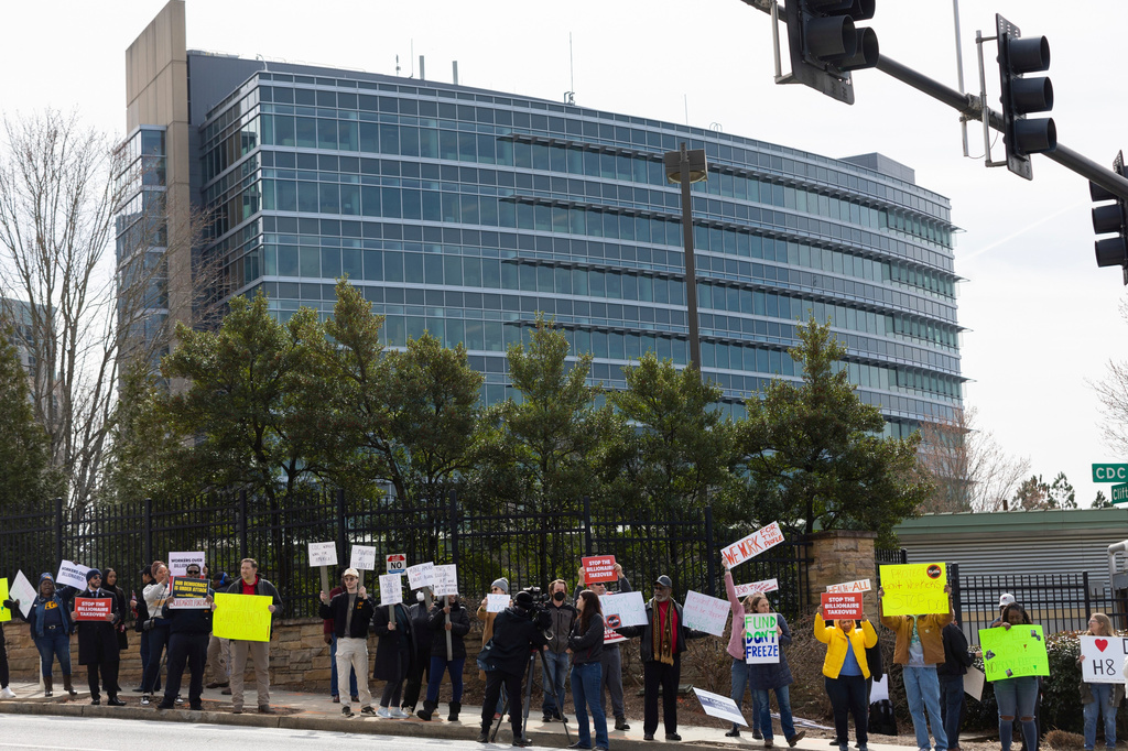 FILE - Demonstrators protest Centers for Disease Control and Prevention (CDC) layoffs in front of the CDC headquarters in Atlanta, Feb. 18, 2025. (Arvin Temkar/Atlanta Journal-Constitution via AP, File)/Atlanta Journal-Constitution via AP)