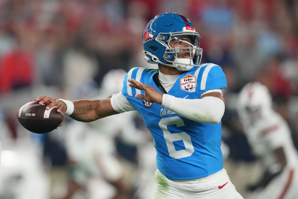 FILE - Mississippi quarterback Trinidad Chambliss throws during the first half of the Fiesta Bowl NCAA college football playoff semifinal game against Miami, Jan. 8, 2026, in Glendale, Ariz. (AP Photo/Rick Scuteri, File)