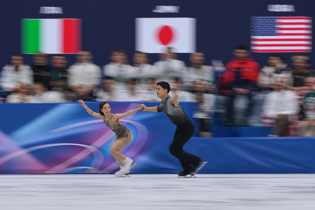 Riku Miura and Ryuichi Kihara of Japan compete during the figure skating pairs team event at the 2026 Winter Olympics, in Milan, Italy, Sunday, Feb. 8, 2026. (AP Photo/Stephanie Scarbrough)