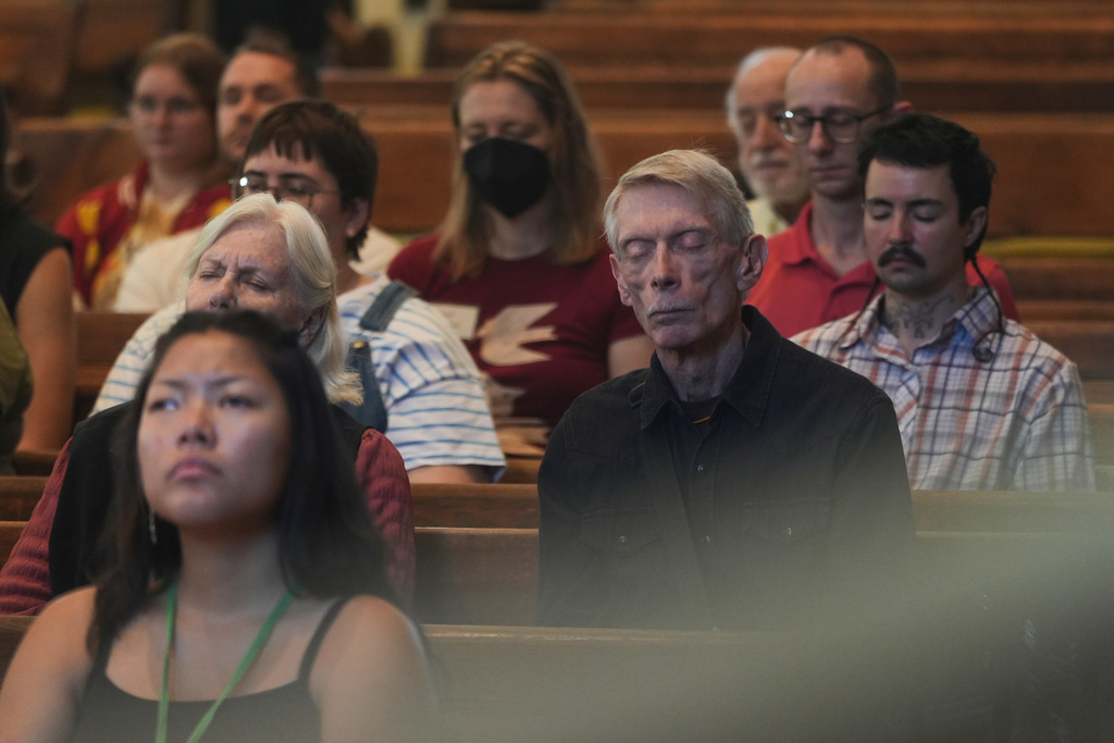 Quakers attend a Sunday worship in the historic West Room of the Arch Street Meeting House in Philadelphia on Oct. 5, 2025. (AP Photo/Luis Andres Henao)