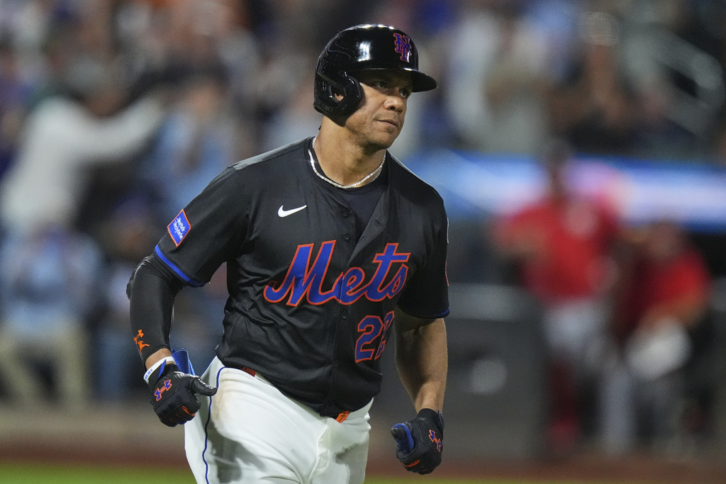 New York Mets' Juan Soto runs the bases after hitting a three-run home run during the fourth inning of a baseball game against the Washington Nationals Friday, Sept. 19, 2025, in New York. (AP Photo/Frank Franklin II)