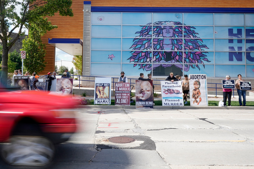 FILE - Protesters are seen outside Planned Parenthood, Sept. 18, 2023, in Milwaukee. (AP Photo/Morry Gash, File) FILE - Protesters are seen outside Planned Parenthood, Sept. 18, 2023, in Milwaukee. (AP Photo/Morry Gash, File)