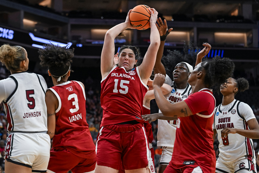 Oklahoma center Raegan Beers (15) grabs a rebound against South Carolina during the first half in the Sweet 16 of the NCAA college basketball tournament Saturday, March 28, 2026, in Sacramento, Calif. (AP Photo/Justine Willard)