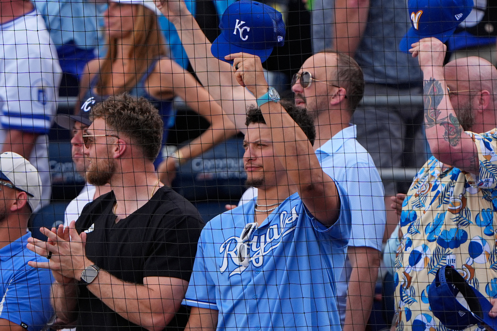 Kansas City Chiefs quarterback Patrick Mahomes watches during the fourth inning of a baseball game between the Kansas City Royals and the Minnesota Twins, Monday, March 30, 2026, in Kansas City, Mo. (AP Photo/Charlie Riedel)