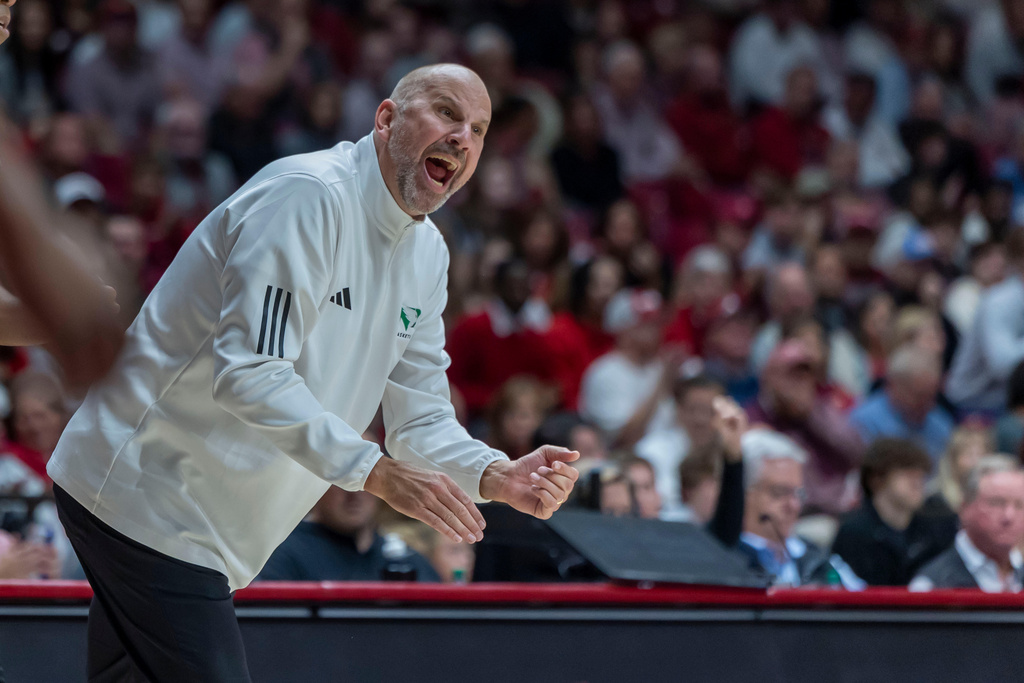 North Dakota head coach Paul Sather works with his team during the first half of an NCAA basketball game against Alabama on Monday, Nov. 3, 2025, in Tuscaloosa, Ala. (AP Photo/Vasha Hunt)