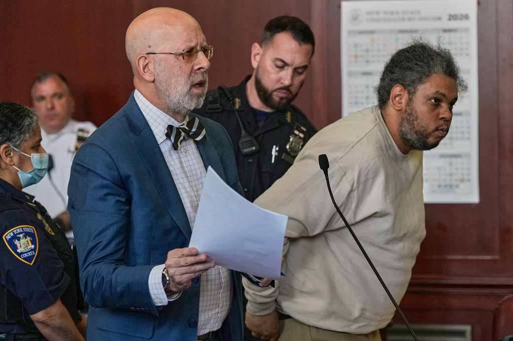 Randy Santos, right, and his attorney Arnold Levine appear in court after he was sentenced for fatally beating four sleeping men on the streets in 2019, in New York, Thursday, May 28, 2026. (AP Photo/Richard Drew)