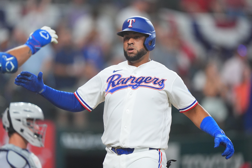 Texas Rangers' Elias Diaz is congratulated after hitting a home run during the second inning of a baseball game against the Detroit Tigers, Thursday, July 2, 2026, in Arlington, Texas. (AP Photo/LM Otero)
