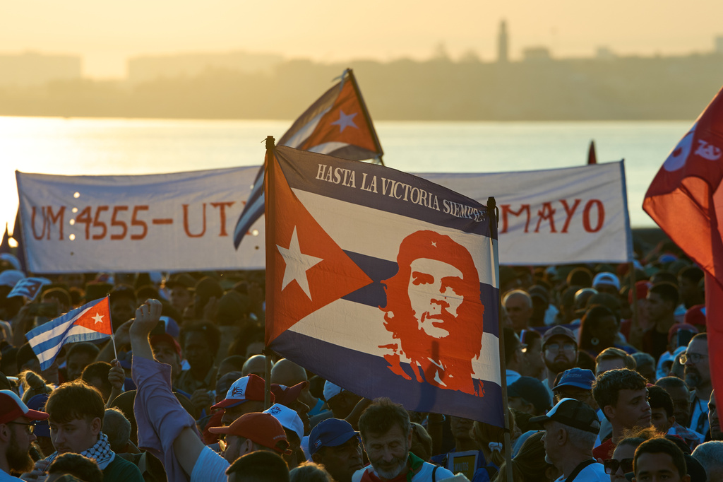 People attend a march marking International Workers' Day at Jose Marti Anti-Imperialist Square in Havana, Cuba, Friday, May 1, 2026. (AP Photo/Ramon Espinosa)