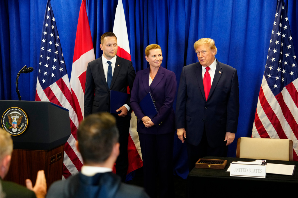 Denmark's Prime Minister Mette Frederiksen, Greenland's Prime Minister Jens-Frederik Nielsen, left, and US President Donald Trump at the signing ceremony of a security deal between the U.S., Denmark and Greenland at United Nations headquarters, Tuesday, Sept. 22, 2026. (Mads Claus Rasmussen/Ritzau Scanpix via AP)