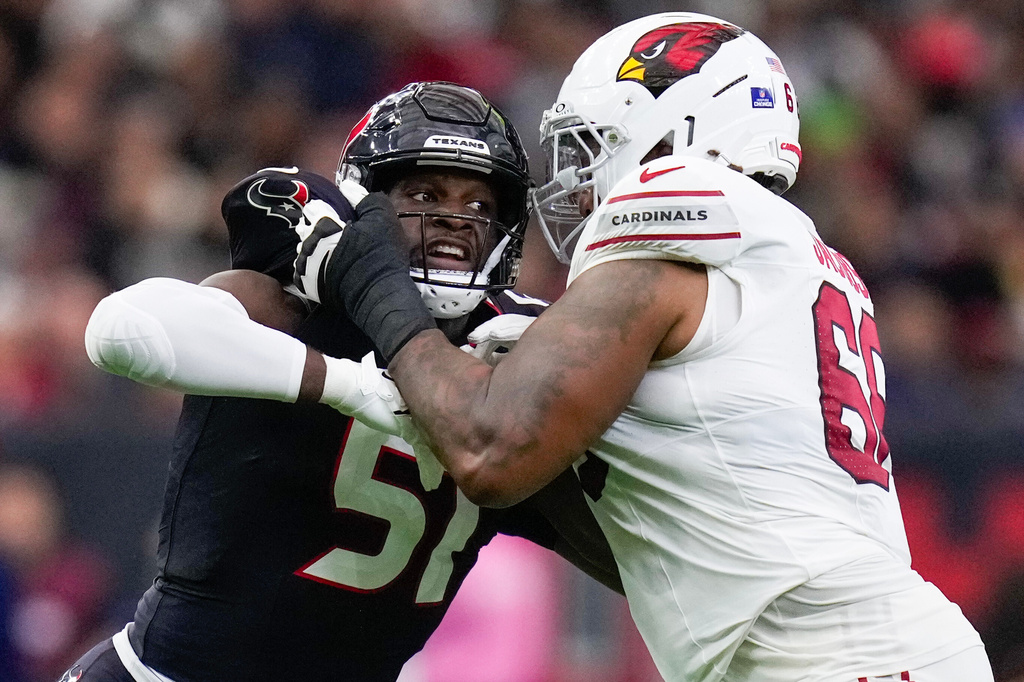 FILE - Houston Texans defensive end Will Anderson Jr. (51) is blocked by Arizona Cardinals offensive tackle Demontrey Jacobs (66) during the first half of an NFL football game, Dec. 14, 2025, in Houston. (AP Photo/Eric Christian Smith, File)