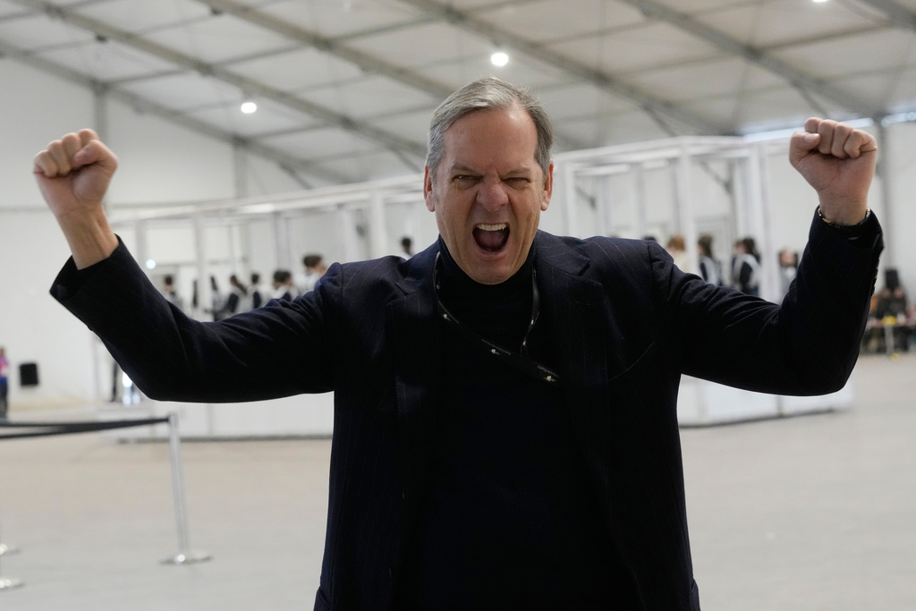Creative Director and Executive Producer Marco Balich gestures as volunteer dancers perform during rehearsals for the opening ceremony of the Milan Cortina 2026 Winter Olympic Games, at a compound in a big tent next to San Siro Stadium, in Milan, Italy, Saturday, Jan. 24, 2026. (AP Photo/Luca Bruno)