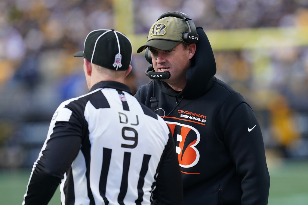 Cincinnati Bengals head coach Zac Taylor speaks with an official during the first half of an NFL football game against the Pittsburgh Steelers, Sunday, Nov. 16, 2025, in Pittsburgh. (AP Photo/Matt Freed)
