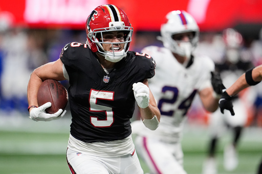 Atlanta Falcons wide receiver Drake London (5) runs after a catch during the first half of an NFL football game against the Buffalo Bills, Monday, Oct. 13, 2025, in Atlanta. (AP Photo/Mike Stewart) Atlanta Falcons wide receiver Drake London (5) runs after a catch during the first half of an NFL football game against the Buffalo Bills, Monday, Oct. 13, 2025, in Atlanta. (AP Photo/Mike Stewart)