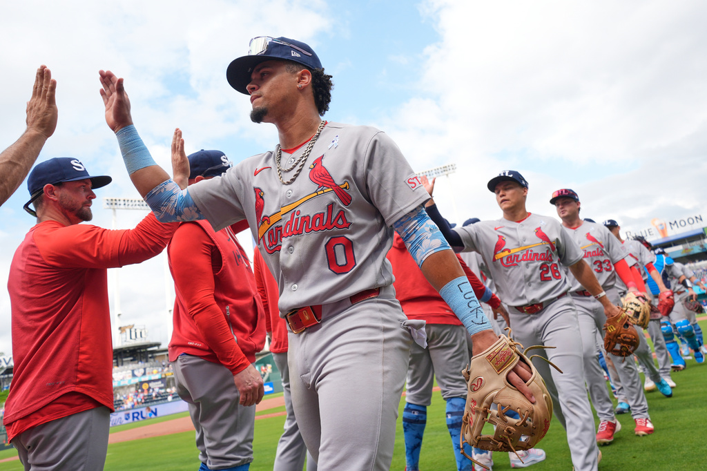St. Louis Cardinals' Masyn Winn (0) celebrates with teammates afte a baseball game against the Kansas City Royals, Sunday, June 21, 2026, in Kansas City, Mo. (AP Photo/Charlie Riedel)