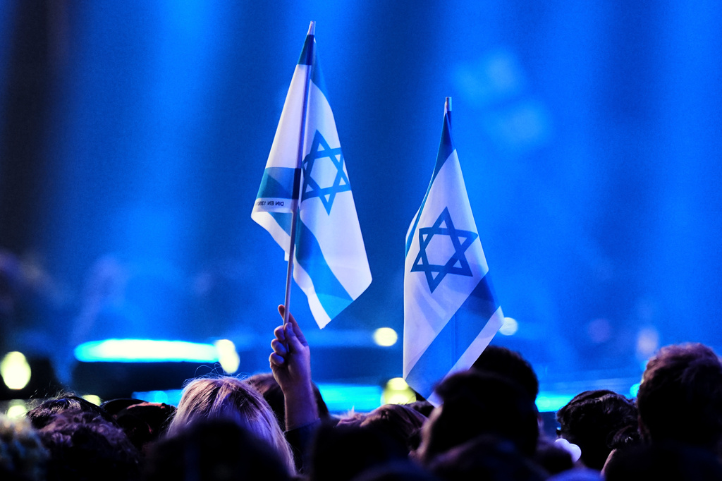 Israeli fans wave their countries flag as they wait for the start of the first semifinal of the 70th Eurovision Song Contest in Vienna, Austria, Tuesday, May 12, 2026. (AP Photo/Martin Meissner)