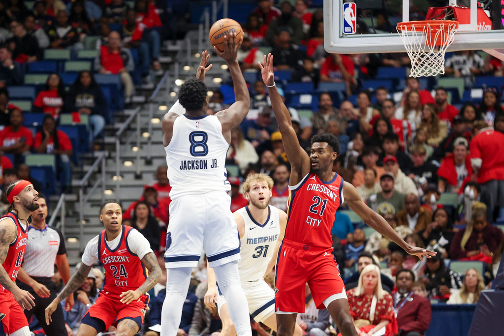 Memphis Grizzlies forward Jaren Jackson Jr. (8) shoots a jumper over New Orleans Pelicans center Yves Missi (21) in the first half of an Emirates NBA Cup basketball game, Wednesday, Nov. 26, 2025, in New Orleans. (AP Photo/Peter Forest)