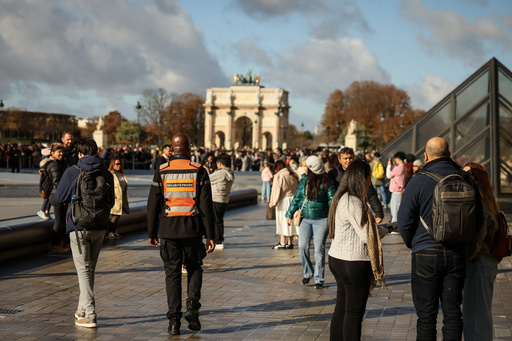 A member of a private security company, center, and visitors walk in the courtyard of the Louvre museum, Sunday, Oct. 26, 2025 in Paris. The Paris prosecutor said that a number of suspects have been arrested over the theft of crown jewels from Paris' Louvre museum last weekend. (AP Photo/Thomas Padilla) A member of a private security company, center, and visitors walk in the courtyard of the Louvre museum, Sunday, Oct. 26, 2025 in Paris. The Paris prosecutor said that a number of suspects have been arrested over the theft of crown jewels from Paris' Louvre museum last weekend. (AP Photo/Thomas Padilla)