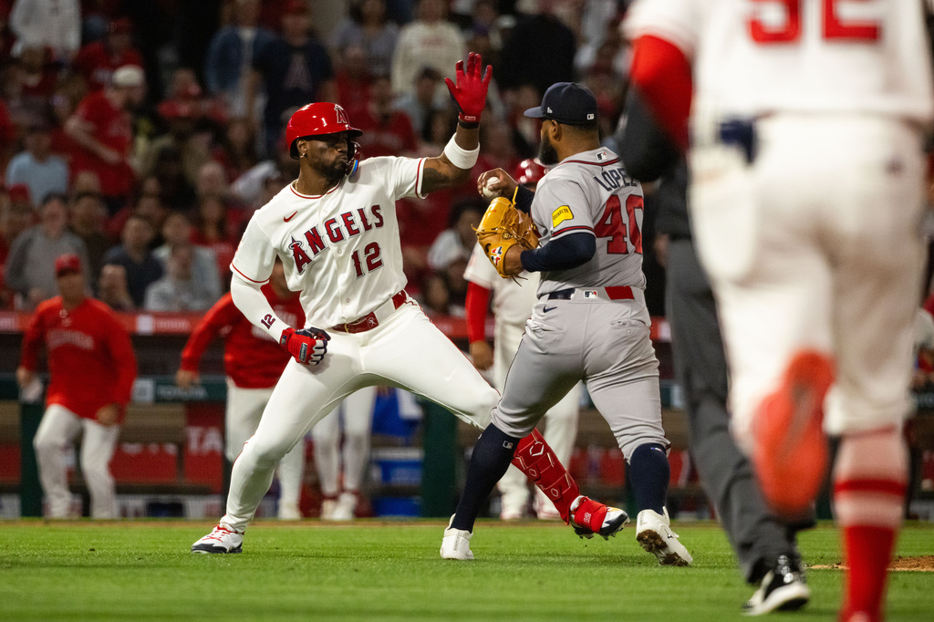 A fight breaks out during the fifth inning of a baseball game between the Los Angeles Angels and the Atlanta Braves, Tuesday, April 7, 2026, in Anaheim, Calif. (AP Photo/Ethan Swope)