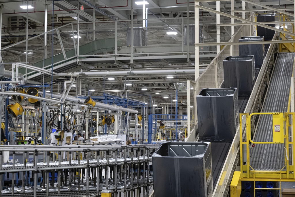 Components travel up a conveyor belt at GE Appliances global headquarters, Wednesday, Aug 13, 2025, in Louisville, Ky. (AP Photo/Jon Cherry)