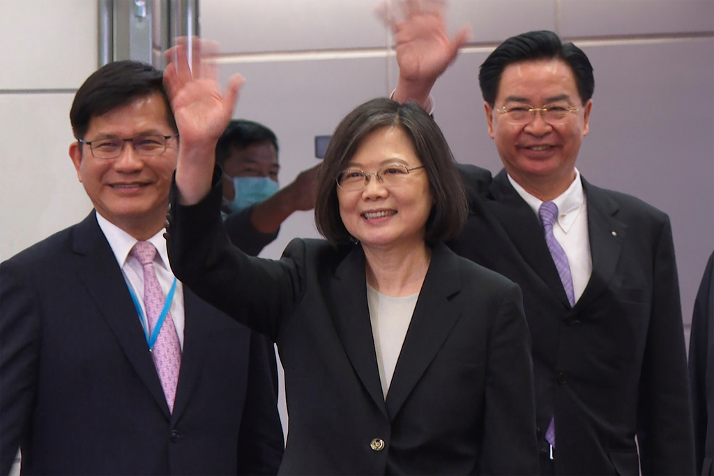 FILE - In this image made from video, Taiwan's Presidential office secretary general Lin Chia-lung, left, President Tsai Ing-wen, center, and Foreign Minister Joseph Wu wave before Tsai's departure on an overseas trip at Taoyuan International Airport in Taipei, Taiwan, Wednesday, March 29, 2023. (AP Photo/Johnson Lai, File)