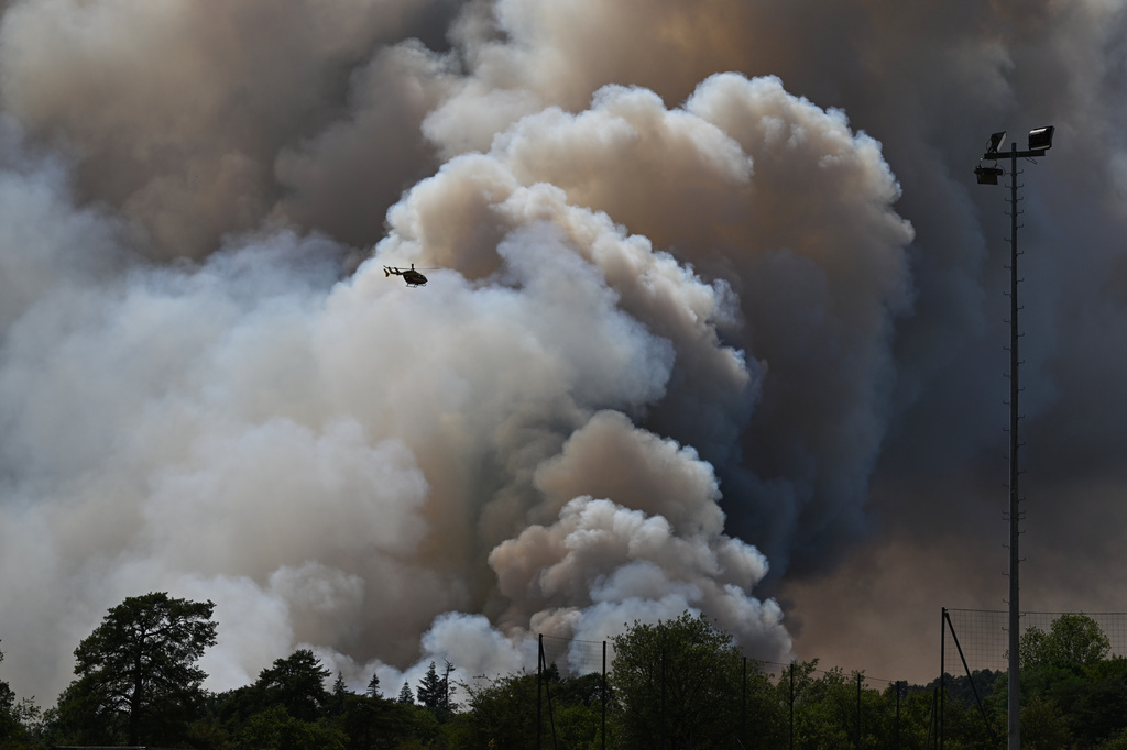 FILE - A pyrocumulonimbus, a giant cloud created by a large wildfire is seen in the Fontainebleau forest region, about 60 kilometers (37 miles) south of Paris, France, Monday, July 13, 2026. (AP Photo/Emma Da Silva, File)