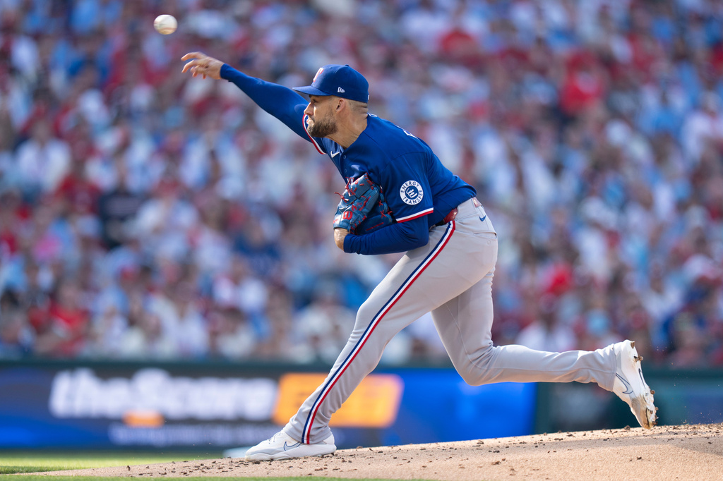 Texas Rangers stating pitcher Nathan Eovaldi delivers during the first inning of an opening-day baseball game against the Philadelphia Phillies, Thursday, March 26, 2026, in Philadelphia. (AP Photo/Chris Szagola)