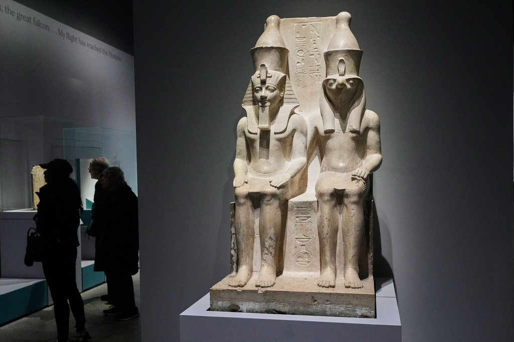 A double statue of King Haremhab and Horus is displayed in the Divine Egypt exhibition, at the Metropolitan Museum of Art, in New York, Tuesday, Oct. 14, 2025. (AP Photo/Richard Drew)