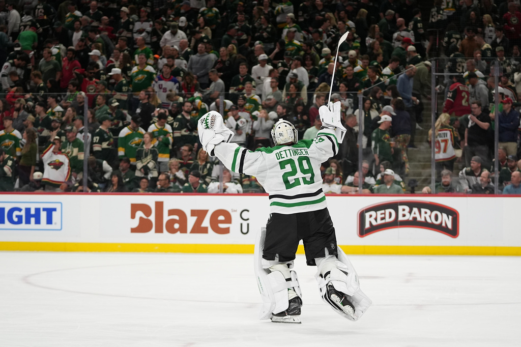 Dallas Stars goaltender Jake Oettinger (29) celebrates after the double overtime win against the Minnesota Wild of Game 3 in the first round of the NHL Stanley Cup hockey playoffs early morning Thursday, April 23, 2026, in St. Paul, Minn. (AP Photo/Abbie Parr)