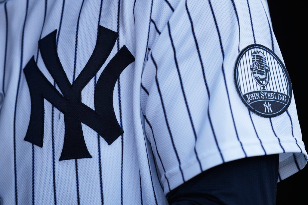A patch memorializing John Sterling, the long-time New York Yankees radio announcer, is seen on a uniform before a baseball game against the Toronto Blue Jays, Monday, May 18, 2026, in New York. (AP Photo/Seth Wenig)