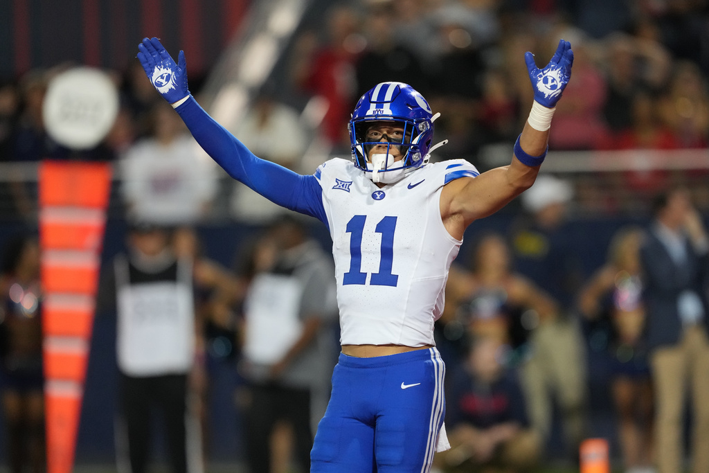 BYU safety Faletau Satuala celebrates after defeating Arizona in two overtimes during an NCAA college football game, Saturday, Oct. 11, 2025, in Tucson, Ariz. (AP Photo/Rick Scuteri)