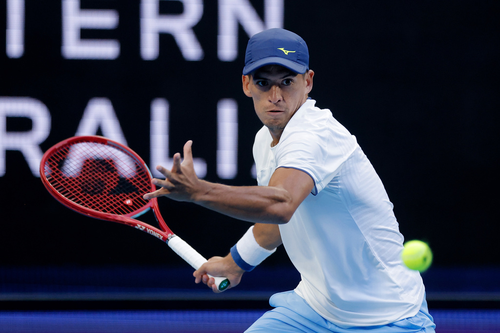 Sebastian Baez of Argentina hits a forehand to Taylor Fritz of the U.S. during their men's singles match at the United Cup tennis tournament in Perth, Saturday, Jan. 3, 2026. (Richard Wainwright/AAP Image via AP)