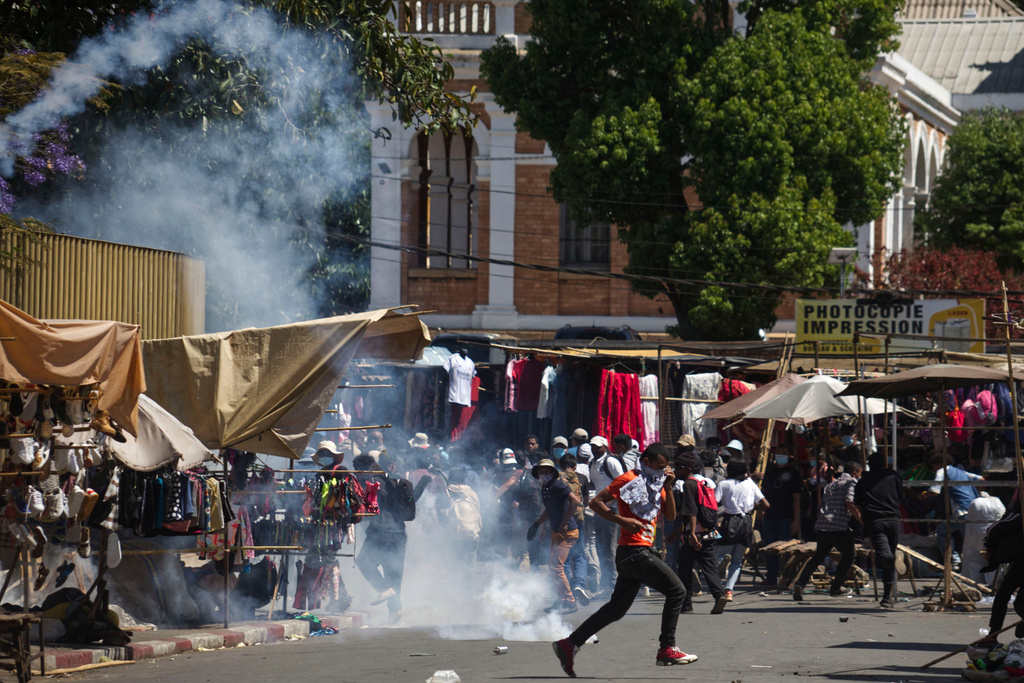 Protesters are tear-gassed during a protest calling for the president to step down in Antananarivo, Madagascar, Thursday, Oct. 9, 2025. (AP Photo/Alexander Joe)