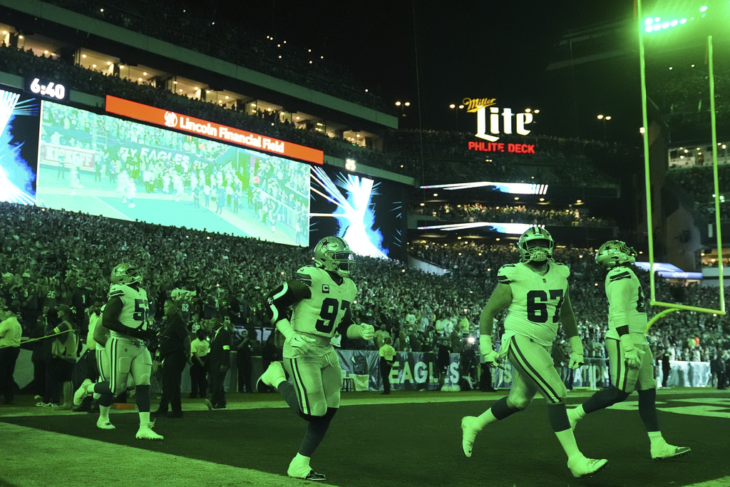 The Dallas Cowboys jog onto the field for the first half of an NFL football game against the Philadelphia Eagles Thursday, Sept. 4, 2025, in Philadelphia. (AP Photo/Matt Rourke)