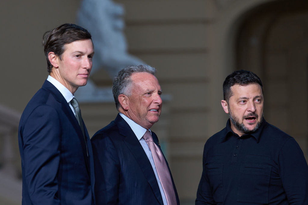 Ukraine's President Volodymyr Zelenskyy, right, stands with Steve Witkoff, center, and Jared Kushner, U.S. President Donald Trump's envoys, at the end of their joint news conference in Kyiv, Ukraine, Sunday, Sept. 6, 2026. (AP Photo/Francisco Seco)