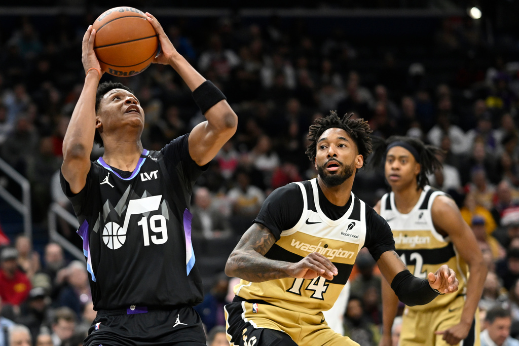 Utah Jazz guard Ace Bailey (19) goes to shoot against Washington Wizards forward Leaky Black (14) during the first half of an NBA basketball game, Thursday, March 5, 2026, in Washington. (AP Photo/John McDonnell)