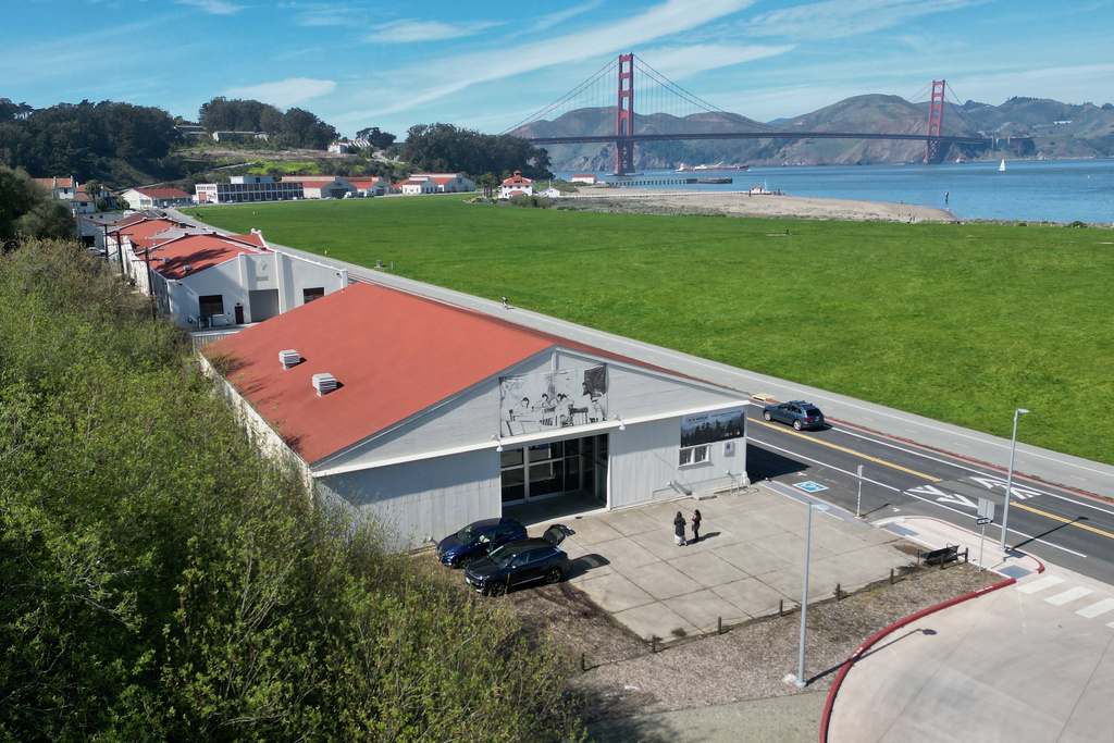 People walk outside of the Military Intelligence Service Historic Learning Center, which is displaying the "I am an American: The Nisei Soldier Experience" exhibit, in San Francisco, Thursday, Feb. 26, 2026. (AP Photo/Terry Chea)